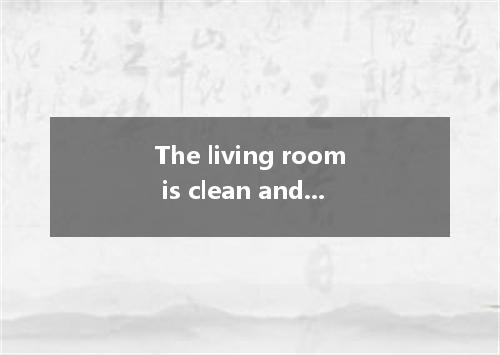 The living room is clean and tidy, with a dining table already for a meal to be 